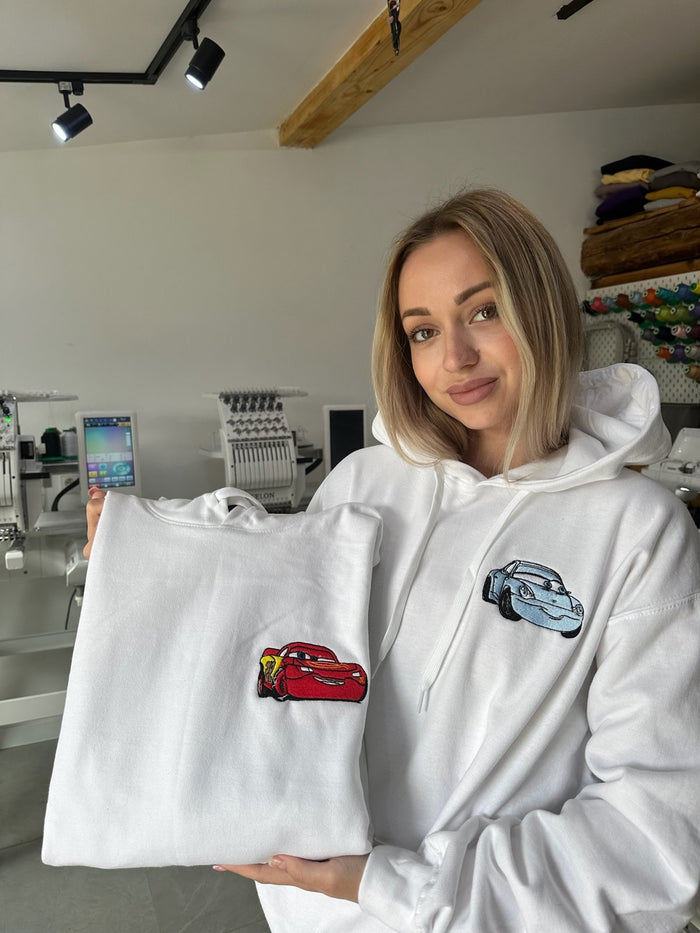 Embroidered car hoodies held by model